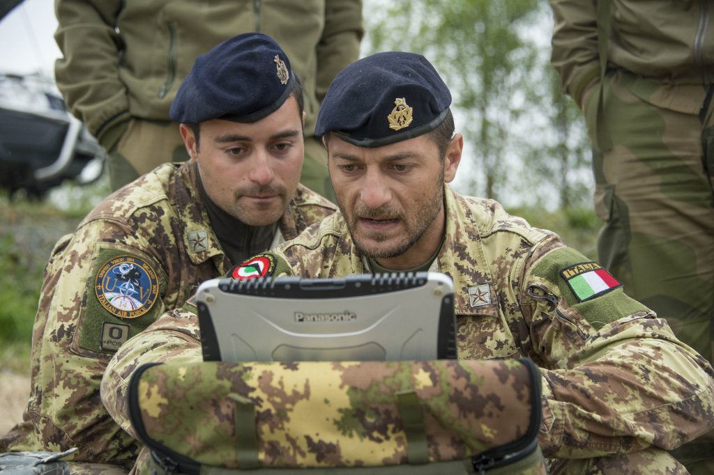 Photo: As part of NATO’s Unified Vision 2014 Trial, members of the Italian Air Force launch a surveillance drone (STRIX, a multi-purpose, man-portable, totally autonomous TUAS) over Oerland, Norway. Credit NATO via Flickr