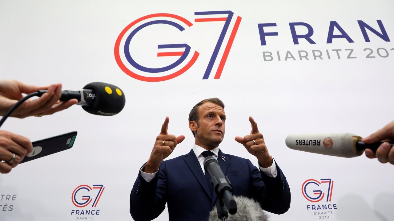 Photo: France’s President Emmanuel Macron gestures as he speaks to the press after a plenary session at the Bellevue centre in Biarritz, France August 25, 2019. Credit: Ludovic Marin/Pool via REUTERS.