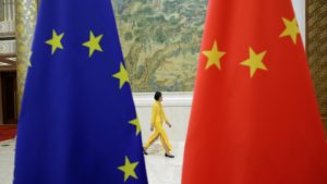 Photo: An attendant walks past flags of EU and China ahead of the EU-China High-level Economic Dialogue at Diaoyutai State Guesthouse in Beijing, China June 25, 2018. Credit: REUTERS/Jason Lee