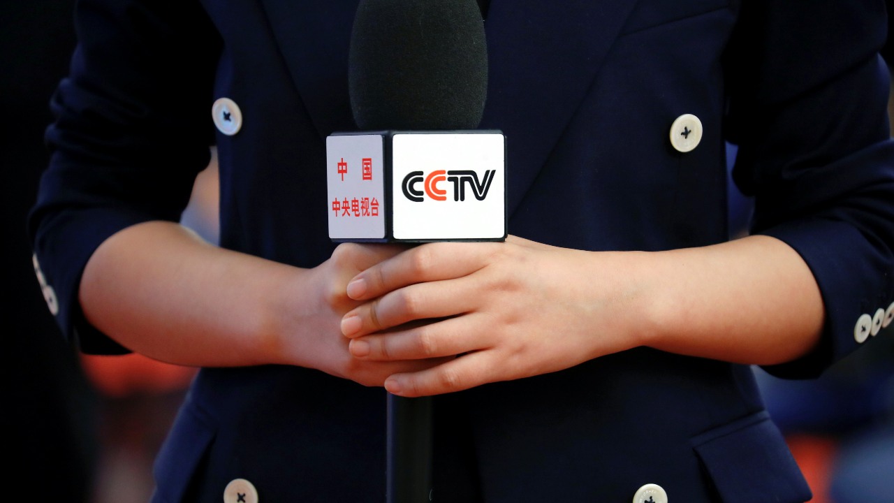 Photo: A presenter of the CCTV state media channel covers a news conference held via video link by Chinese State Councillor and Foreign Minister Wang Yi, on the sidelines of the National People's Congress (NPC), in Beijing, China March 7, 2021. Credit: REUTERS/Thomas Peter