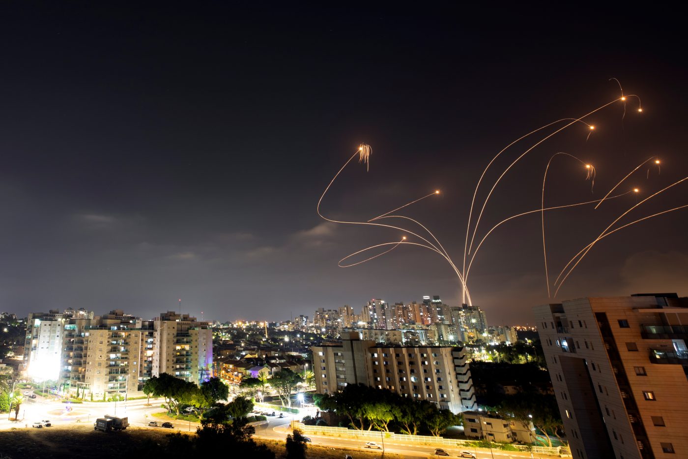Photo: Streaks of light are seen as Israel's Iron Dome anti-missile system intercepts rockets launched from the Gaza Strip towards Israel, as seen from Ashkelon, Israel May 10, 2021. Picture taken with slow shutter speed. Credit: REUTERS/Amir Cohen