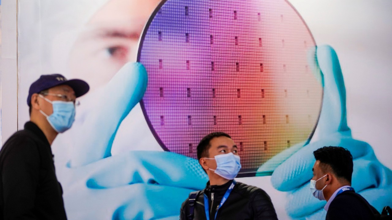 Photo: People visit a display of semiconductor device at Semicon China, a trade fair for semiconductor technology, in Shanghai, China March 17, 2021. Credit: REUTERS/Aly Song/File Photo