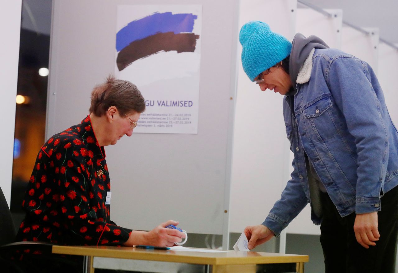 Photo: A man casts his vote during general election at the polling station in Tallinn, Estonia March 3, 2019. Credit: REUTERS/Ints Kalnins