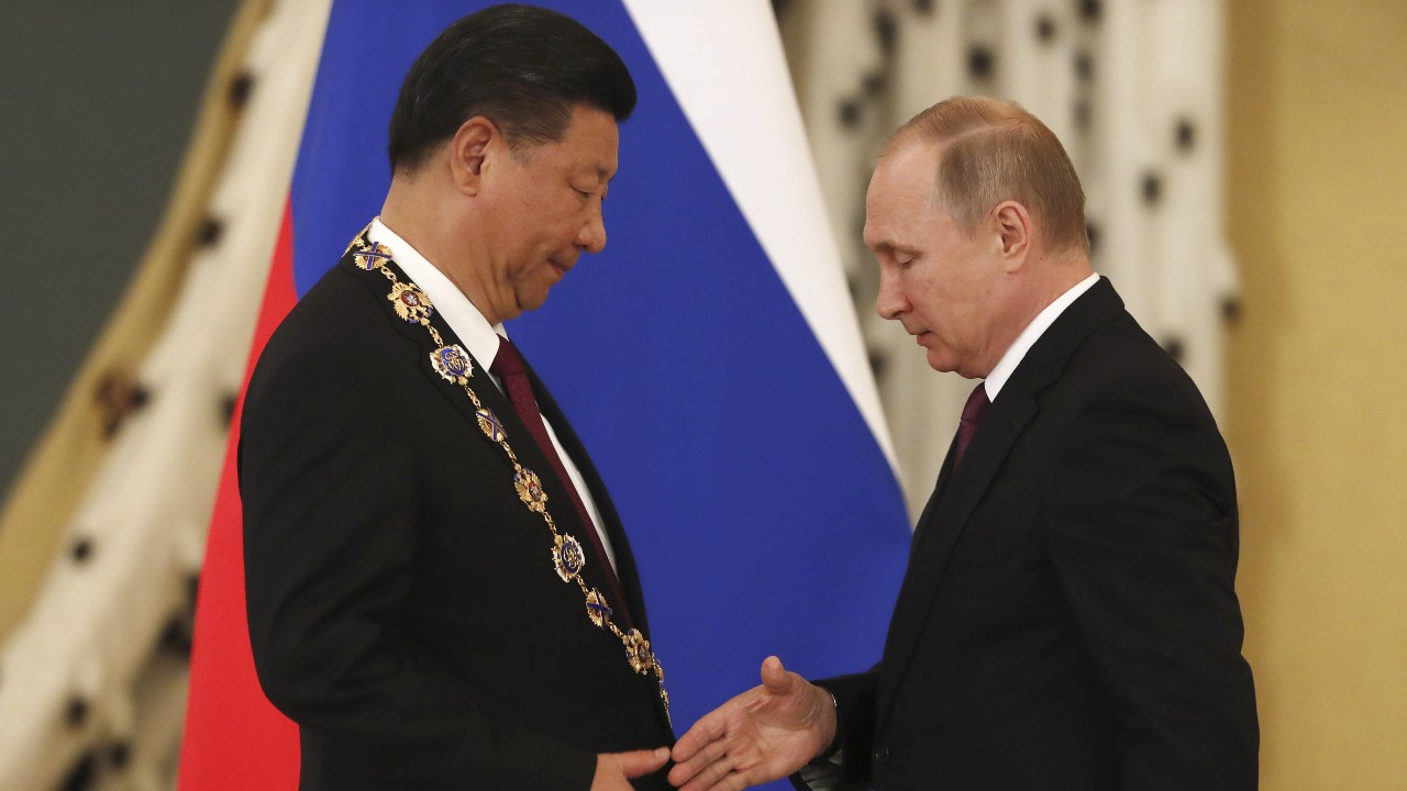 Photo: Russian President Vladimir Putin (R) shakes hands with his Chinese counterpart Xi Jinping after awarding him with the Order of St. Andrew the Apostle the First-Called during a meeting at the Kremlin in Moscow, Russia July 4, 2017. Credit: REUTERS/Sergei Ilnitsky/Pool TPX IMAGES OF THE DAY