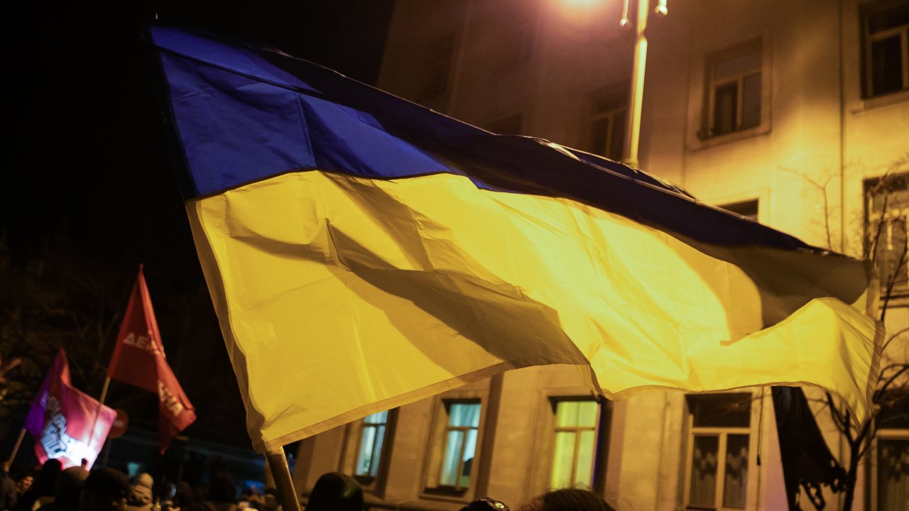 Photo: KIEV, UKRAINE - DECEMBER 1, 2021: People hold the Ukrainian flag during a rally titled Defend Ukraine - Stop the Coup in Independence Square in central Kiev. The protesters demand the resignation of President Volodymyr Zelensky and a 'total reboot of the state power'. Credit: Irina Yakovleva/TASS.
