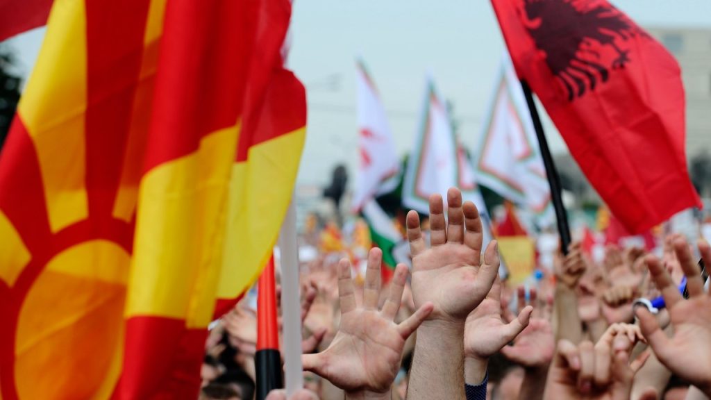 Photo: Protesters waving Macedonian and Albanian flags raise their hands during an anti-government demonstration in Skopje, Macedonia, May 17, 2015. Tens of thousands of protesters took to the streets of Macedonia's capital on Sunday, waving Macedonian and Albanian flags in a dramatic display of ethnic unity against a government on the ropes after months of damaging wire-tap revelations. Credit: REUTERS/Ognen Teofilovski