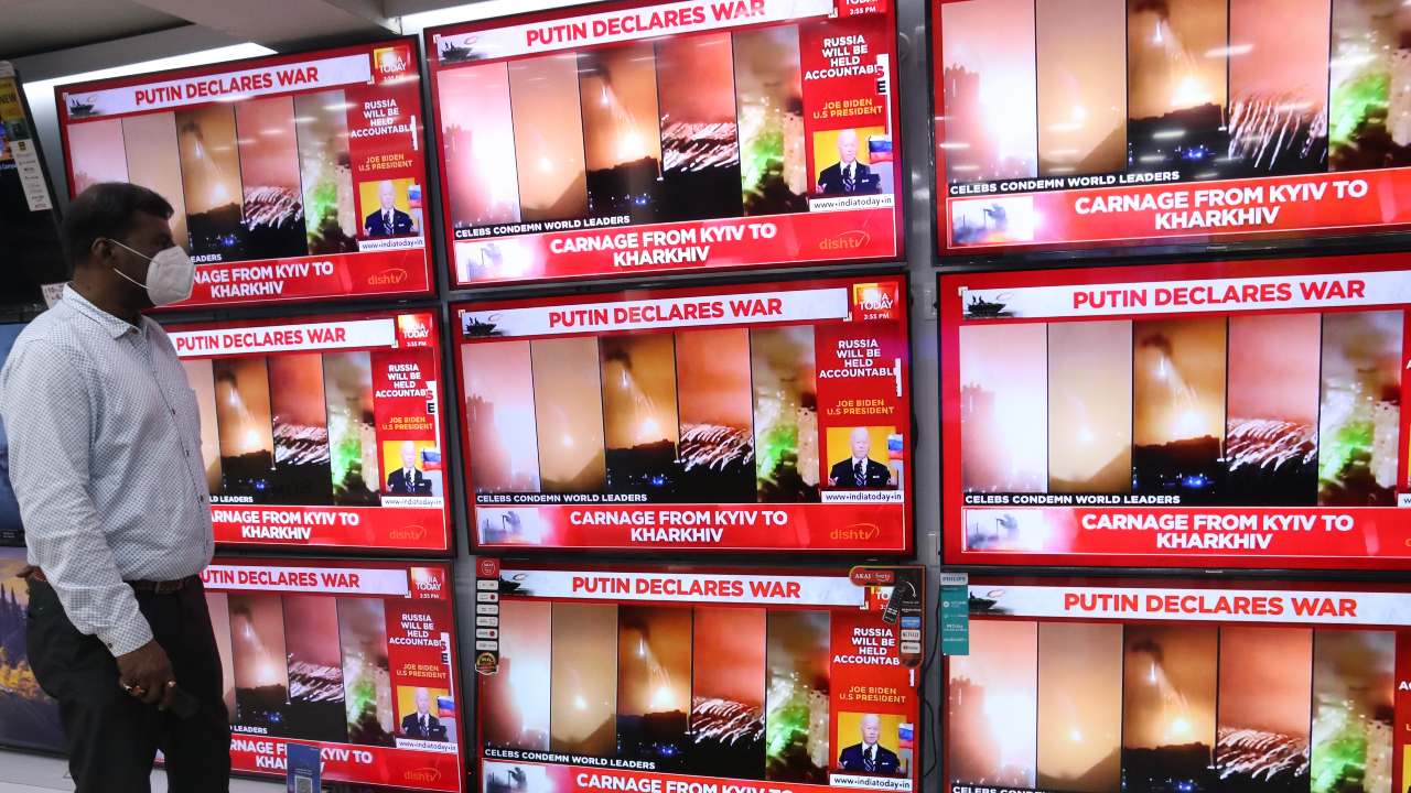 Photo: A man watches a coverage of the conflict between Russia and Ukraine displayed on televisions at a electronics item shop in Kolkata, India on February 25, 2022. Credit: Debajyoti Chakraborty/NurPhoto