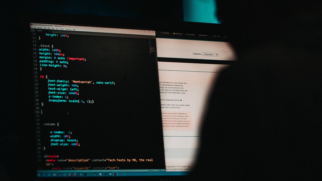 Photo: Someone programming a website in HTML. Credit: Mika Baumeister via Unsplash