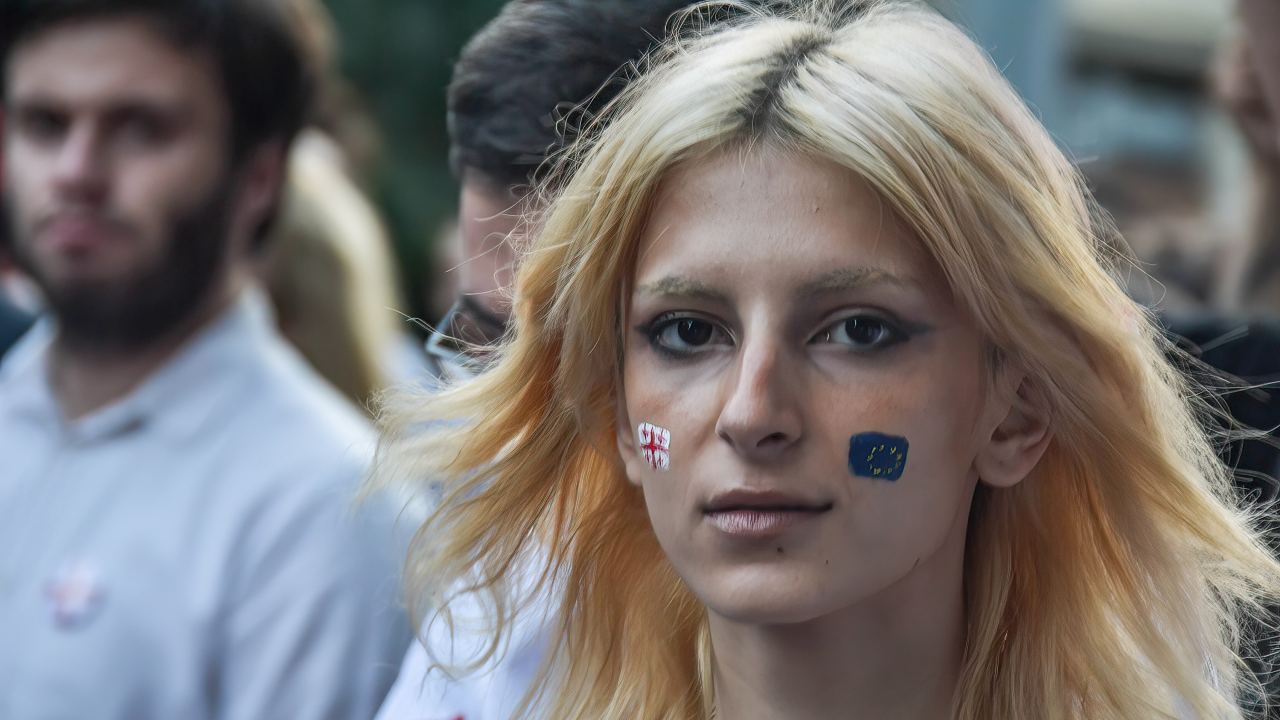 Photo: A student looks on with her face painted during the demonstration. Pro EU protesters gathered in Tbilisi demanding to join EU, and the resignation of Prime Minister of Georgia and the whole government. Credit: Photo by Nicolo Vincenzo Malvestuto / SOPA Images/Sipa USA