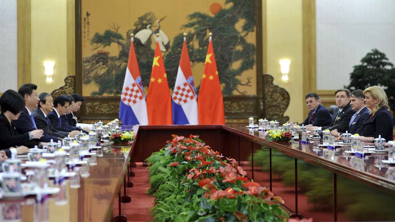 Photo: Chinese President Xi Jinping (2nd L) speaks during a meeting with Croatian President Kolinda Grabar-Kitarovic (R) at the Great Hall of the People in Beijing, China, October 14, 2015. Credit: REUTERS/Parker Song/Pool.