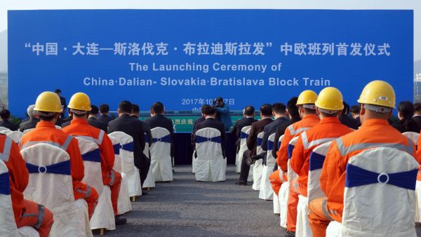 Photo: Chinese workers attend the launching ceremony of China Dalian ¨C Slovakia Bratislava Block Train before departing from a cargo railway station in Shenyang city, northeast China's Liaoning province, 27 October 2017. A freight train