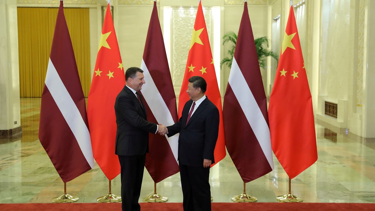 Photo: Latvia's President Raimonds Vejonis shakes hands with China's President Xi Jinping at The Great Hall Of The People in Beijing, China September 18, 2018. Credit: Lintao Zhang/Pool via REUTERS.