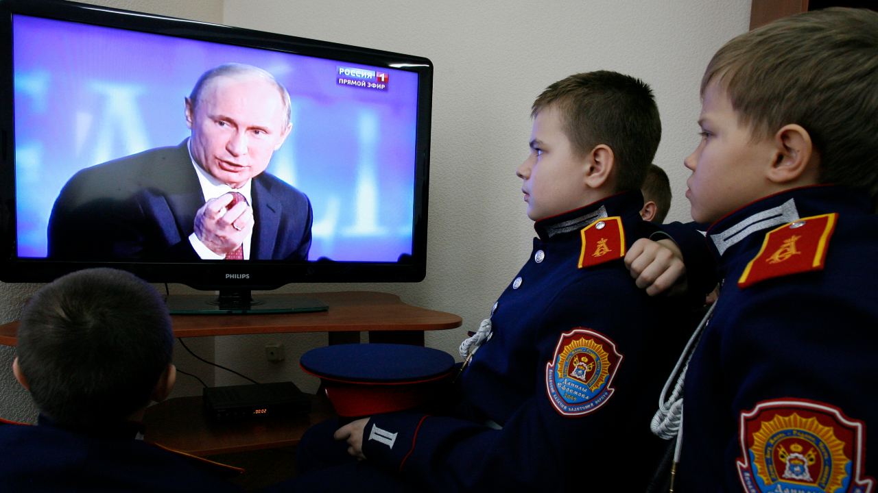 Photo: Cadets watch Russian President Vladimir Putin's annual news conference on TV at the cadet school outside the southern Russian city of Rostov-on-Don December 20, 2012. Putin said on Thursday a U.S. law that punishes Russians who abuse human rights was poisoning ties with Washington but signalled support for a retaliatory ban on Americans adopting Russian children. Credit: REUTERS/Vladimir Konstantinov
