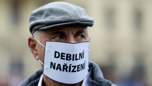 Photo: A demonstrator wearing a mask reading "stupid restrictions" looks on during a protest against the Czech government's restrictions as the spread of the coronavirus disease (COVID-19) continues in Prague, Czech Republic, October 28, 2020. Credit: REUTERS/David W Cerny