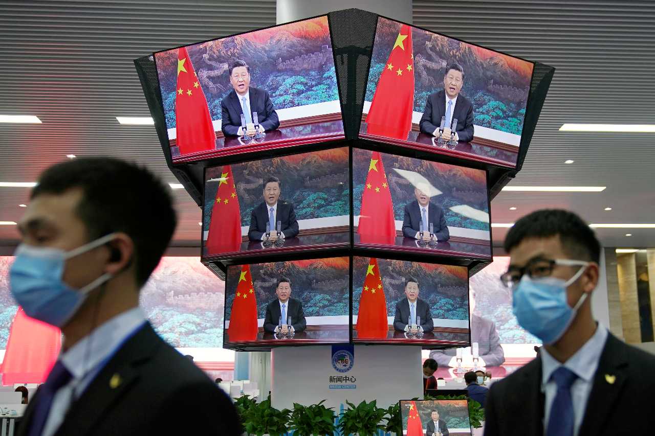 Photo: China's President Xi Jinping is seen on screens in the media center as he speaks at the opening ceremony of the third China International Import Expo (CIIE) in Shanghai, China November 4, 2020. Credit: REUTERS/Aly Song