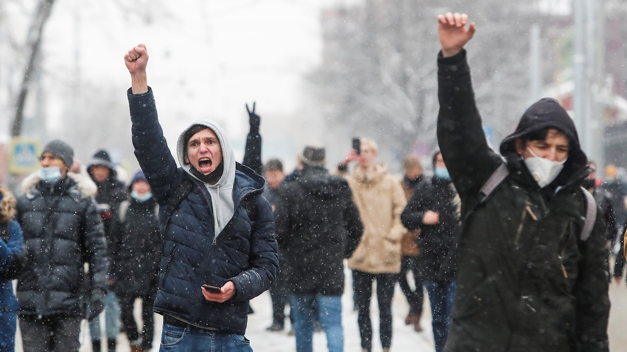 Photo: Protestors raise their fists during a rally in support of jailed Russian opposition leader Alexei Navalny in Moscow, Russia January 31, 2021. Credit: REUTERS/Maxim Shemetov