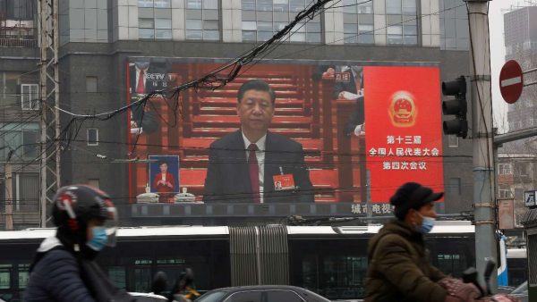 Photo: A giant screen shows Chinese President Xi Jinping attending the opening session of the National People's Congress (NPC) at the Great Hall of the People, in Beijing, China March 5, 2021. Credit: REUTERS/Tingshu Wang