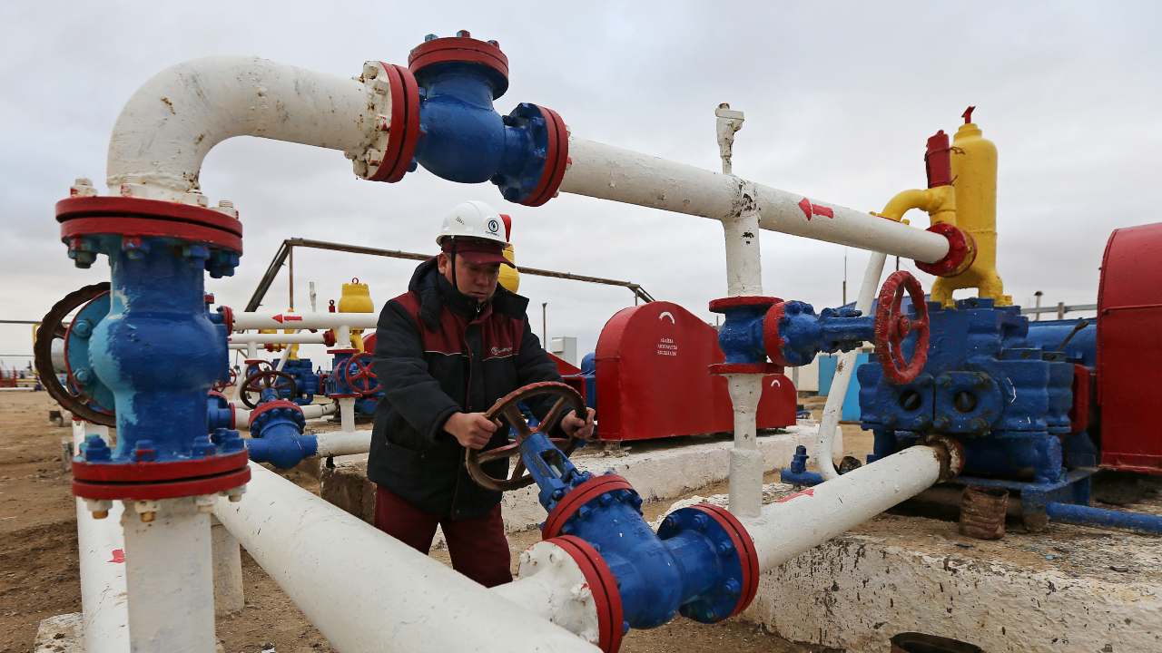 Photo: A worker checks the pressure of pumps at an oil-pumping station in the Uzen oil and gas field in the Mangistau Region of Kazakhstan November 13, 2021. Credit: REUTERS/Pavel Mikheyev.
