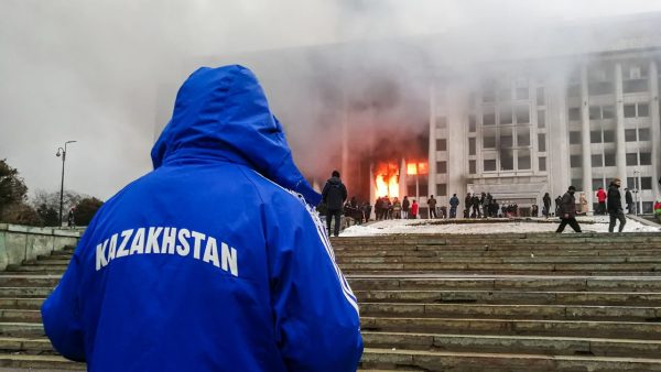 Photo: ALMATY, KAZAKHSTAN - JANUARY 5, 2022: People rally outside the burning mayor’s office. Protests are spreading across Kazakhstan over the rising fuel prices; protesters broke into the Almaty mayor’s office and set it on fire. Credit: Yerlan Dzhumayev/TASS.