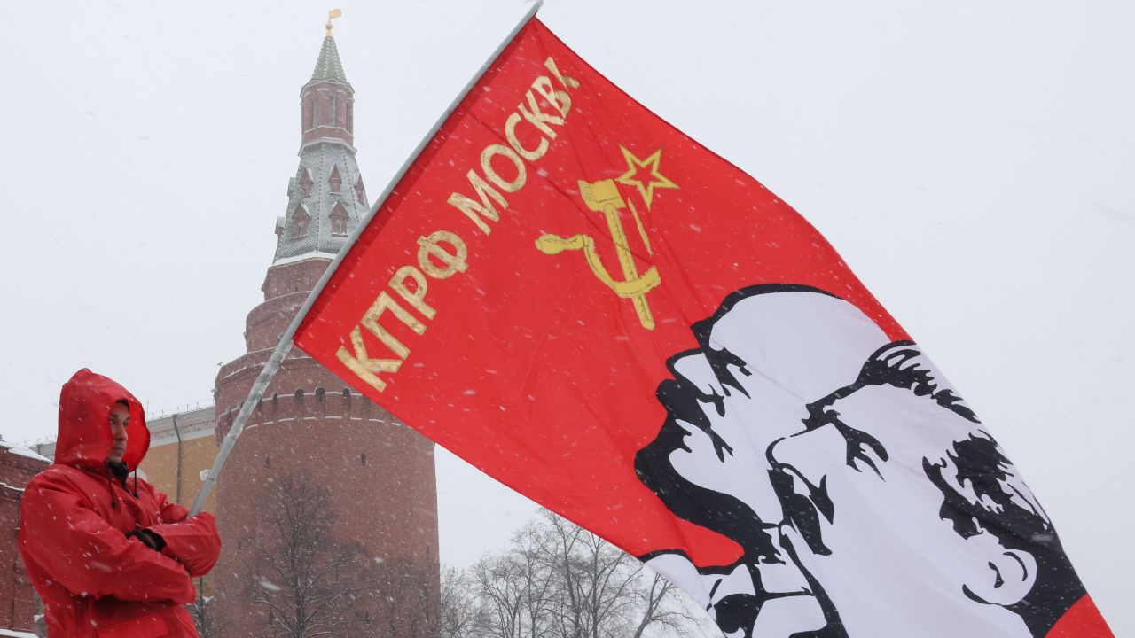 Photo: MOSCOW, RUSSIA - JANUARY 21, 2022: A man waves a KPRF (Russian Communist Party) banner during a flower laying ceremony held at the Mausoleum to mark Vladimir Lenin's 98th death anniversary. Born in Simbirsk (present-day Ulyanovsk) in 1870 as Vladimir Ulyanov, Lenin was a revolutionary and politician known as the founder of the Russian Communist Party. Credit: Mikhail Metzel/TASS