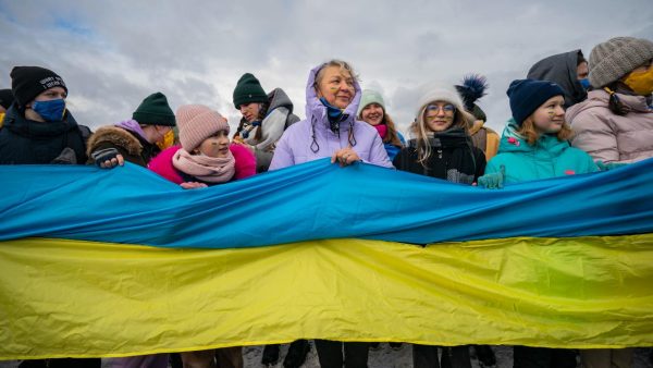 Photo: People hold a long ukrainian flag in a nationalist march along the Paton bridge during the celebration of the Day of Unity in Kiev, Ukraine. On January 22, 1918, the Universal of the Central Rada proclaimed the independence of the Ukrainian People's Republic, and on January 22, 1919, an Act of Unification of Ukrainian lands into a single Ukraine was declared in Kyiv. Credit: Celestino Arce/NurPhoto