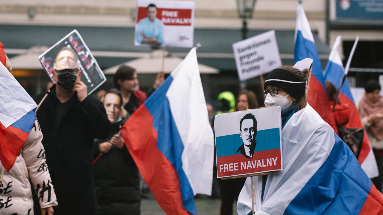 Photo: Aleksei Navalny supporters take part in Free Navalny protest in Duesseldorf, Germany on January 22, 2022 after a year his jailing. Credit: Ying Tang/NurPhoto.