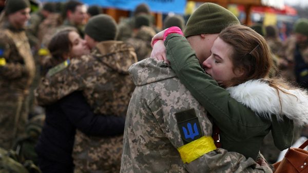 Photos: Olga hugs her boyfriend Vlodomyr as they say goodbye prior to Vlodomyr’s deployment closer to the front line, amid Russia's invasion of Ukraine, at the train station in Lviv, Ukraine, March 9, 2022. Credit: REUTERS/Kai Pfaffenbach