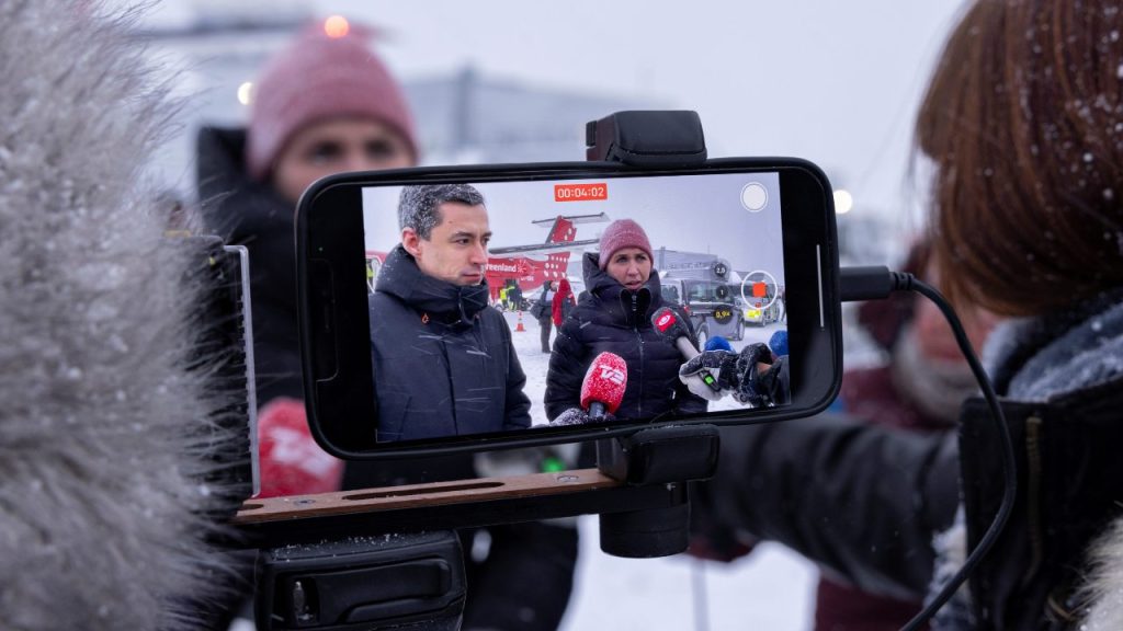 Photo: Chairman of the Naalakkersuisut Mute B. Egede and Denmark's Prime Minister Mette Frederiksen are seen on a video recording of a mobile phone as they speak to the media at the airport in Nuuk, Greenland March 14, 2022. Picture taken March 14, 2022. Credit: Christian Klindt Soelbeck/Ritzau Scanpix/via REUTERS