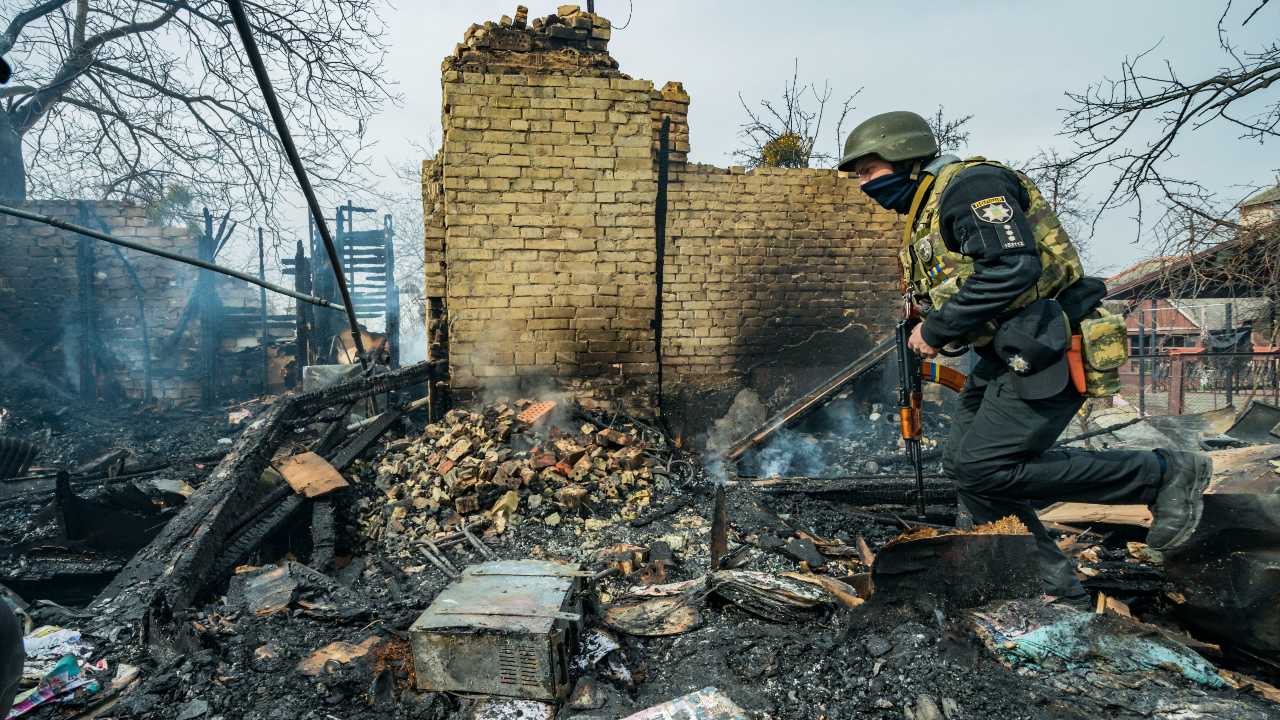 Photo: Ukrainian police checks a house in ruins by fire after the strikes of the russian artillery on Boyarka village, in outskirts of Kyiv. Credit: Celestino Arce/NurPhoto