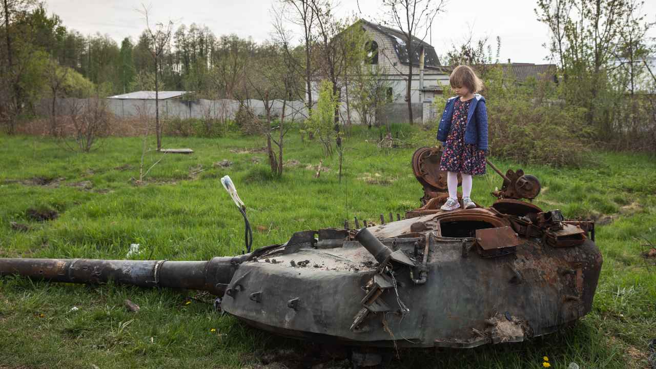 Photo: A girl stands on the tower of a destroyed Russian tank near Makariv village, Kyiv region. Russia invaded Ukraine on 24 February 2022, triggering the largest military attack in Europe since World War II. Credit: Photo by Mykhaylo Palinchak / SOPA Images/Sipa USA.