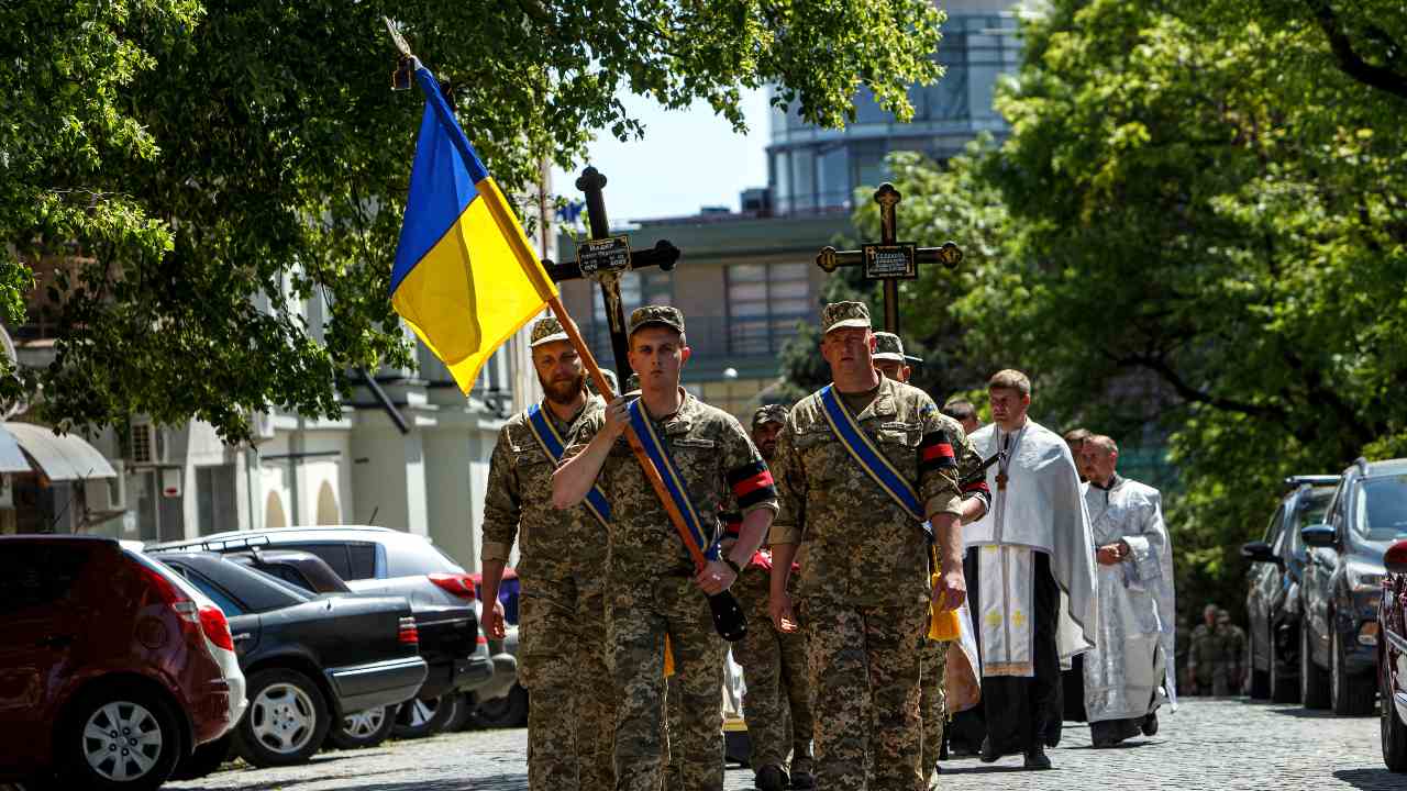 Photo: UZHHOROD, UKRAINE - MAY 16, 2022 - Servicemen carry the national flag during the farewell ceremony for Ukrainian defenders Oleksandr Serousov and Robert Madyar who died in combat with Russian occupiers, Uzhhorod, western Ukraine. This photo cannot be distributed in the Russian federation., on May 16, 2022 Credit: Photo by Serhii Hudak/Ukrinform/NurPhoto.