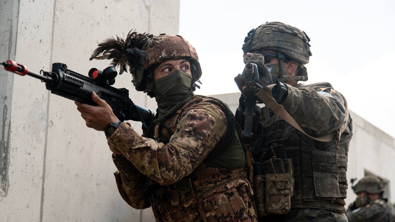 Photo: An Italian and Spanish soldier get ready for room-clearing drills during urban operations training as part of exercise Steadfast Defender 2021. Credit: NATO
