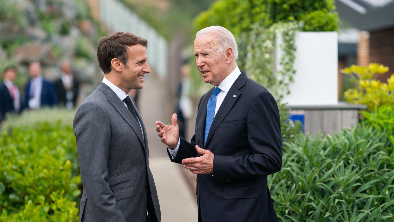 Photo: President Joe Biden and French President Emmanuel Macron talk prior to the first session of the G7 Summit on Friday, June 11, 2021, at the Carbis Bay Hotel and Estate in St. Ives, Cornwall, England. Credit: Adam Schultz