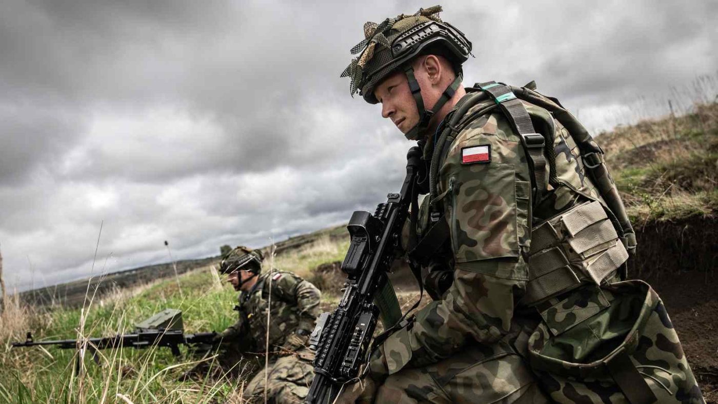 Photo: Polish soldiers peer downrange during a live-fire exercise in Cincu, Romania on 28 April 2022. French and Polish forces deployed to Romania as part of the new NATO multinational battlegroup held a live-fire exercise alongside their Romanian counterparts at Cincu Training Area, Romania. Credit: NATO via Flickr.