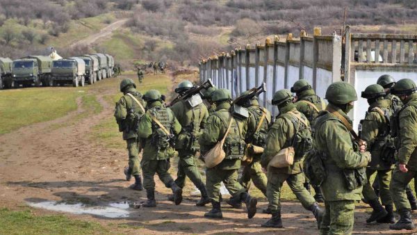 Photo: Little Green Men and lorries after the seizure of Perevalne military base, March 9, 2014. Credit: Wikimedia Commons
