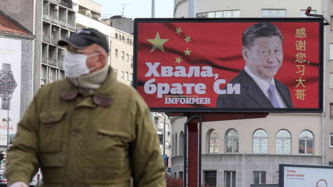 Photo: A man wearing a protective mask passes by a billboard depicting Chinese President Xi Jinping as the spread of the coronavirus disease (COVID-19) continues in Belgrade, Serbia, April 1, 2020. The text on the billboard reads "Thanks, brother Xi". Picture taken April 1, 2020. Credit: REUTERS/Djordje Kojadinovic