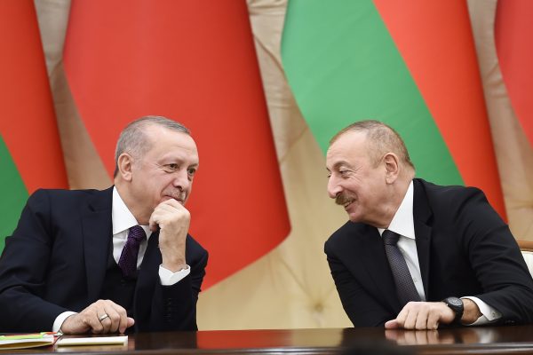 Photo: President Ilham Aliyev of Azerbaijan (right) signs a bilateral agreements with President Recep Tayyip Erdoğan of Turkey (left), February 25, 2020. Credit: President Administration of Azerbaijan