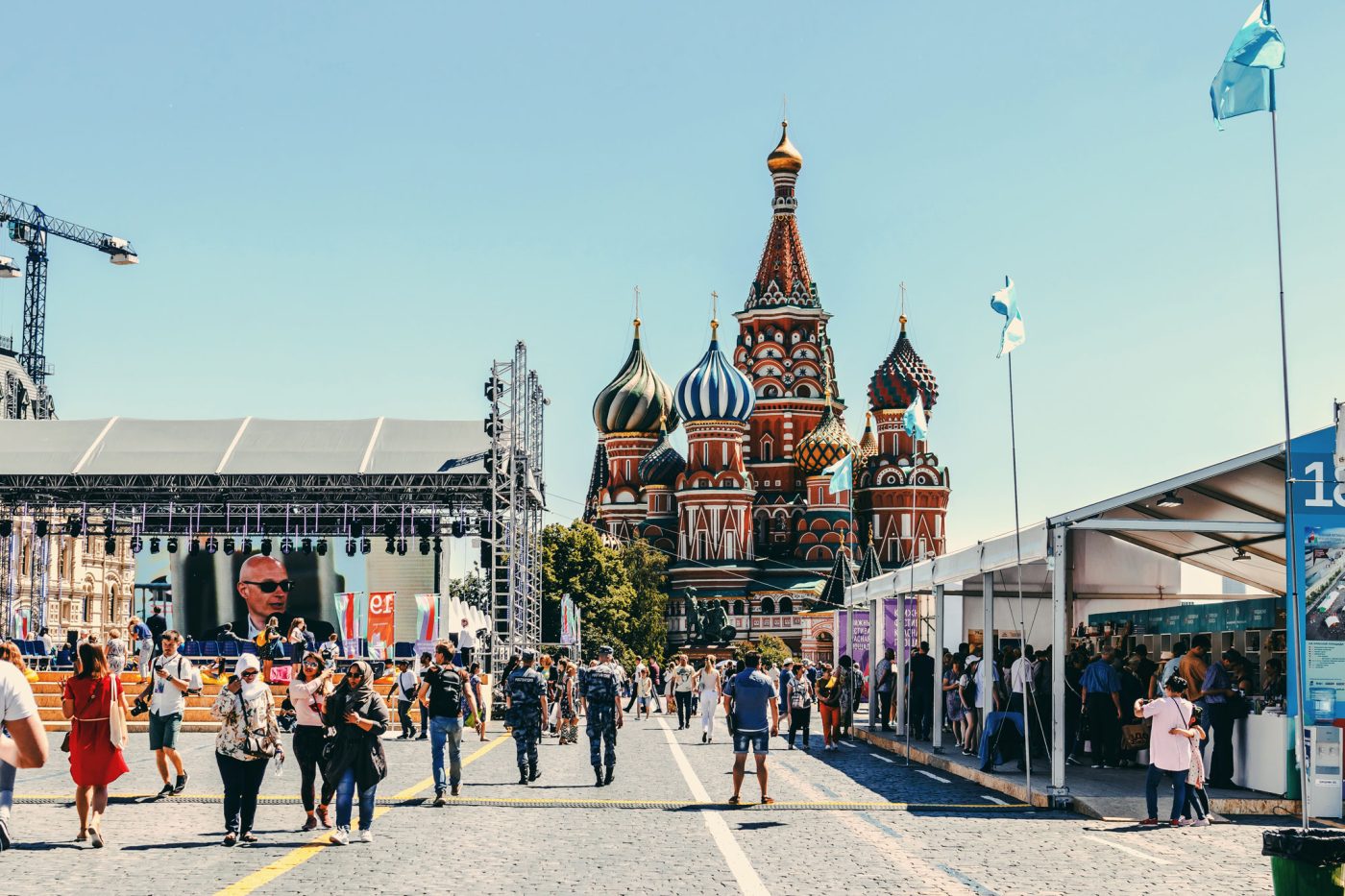 Photo: "People walking near St. Basil's Cathedral in Moscow" by Artem Beliaikin via Pexels. 