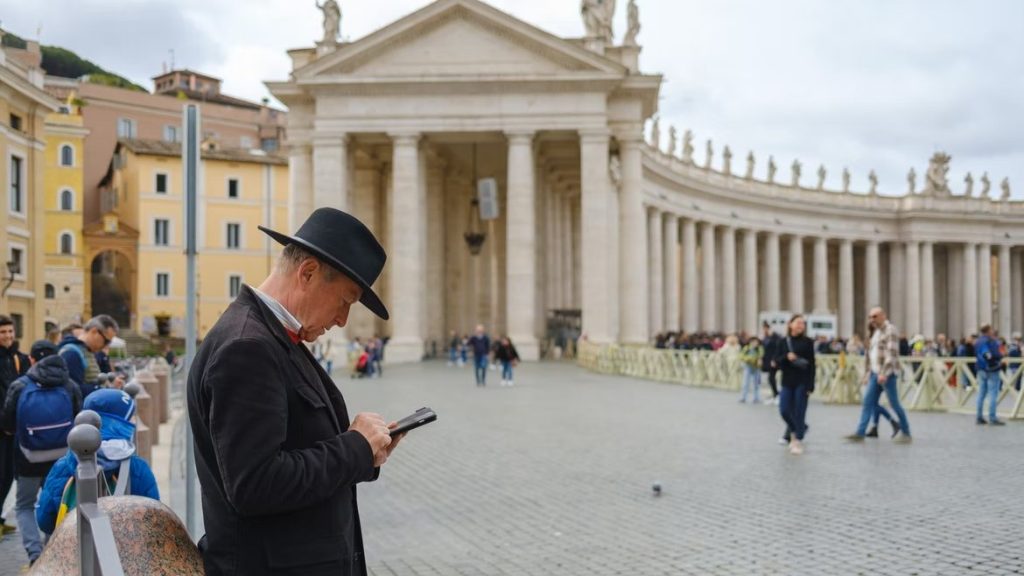 Photo: Man uses phone Rome, Metropolitan City of Rome, Italy. Credit: Josè Maria Sava via Unsplash.
