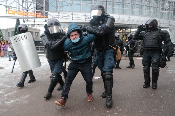 Photo: Riot police officers detain a man during a rally in support of jailed Russian opposition leader Alexei Navalny in Saint Petersburg, Russia, on January 31, 2021. Credit: Photo by Anatolij Medved/NurPhoto