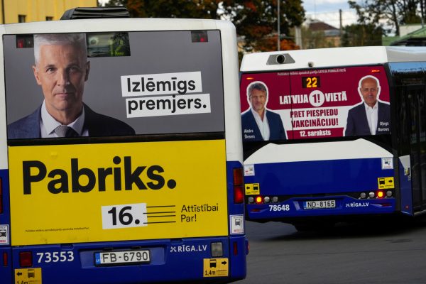 Photo: Buses with an election campaign posters depicting Latvian Defence Minister Artis Pabriks and leaders of Latvia First party are seen in Riga, Latvia September 28, 2022. Credit: REUTERS/Ints Kalnins