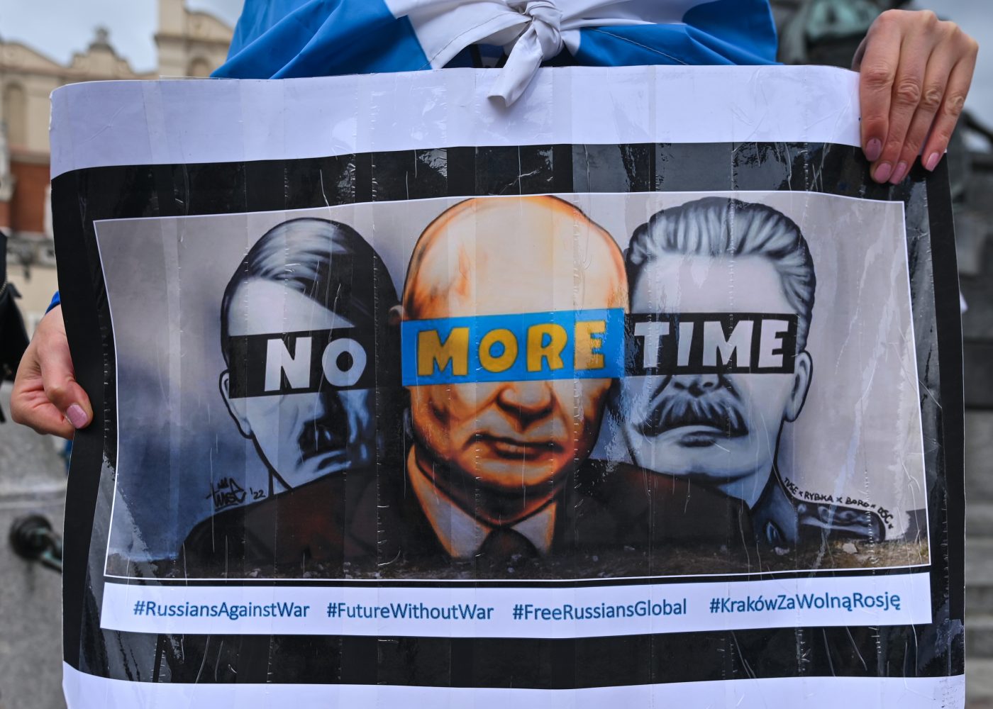Photo: Members of the local Russian diaspora in Krakow are seen during a silent anti-war demonstration and protest against Vladimir Putin and the war with Ukraine at the Adam Mickiewicz Monument in Krakow's Main Square. On Sunday, October 02, 2022, in Krakow, Poland. Credit: Artur Widak/NurPhoto