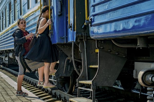 Photo: Women board the evacuation train for displaced people from Donetsk and Luhansk areas destroyed by the constant Russian shelling during the combats between the Ukrainian and Russian armies to control the Donbas, Ukraine. Credit: Celestino Arce/NurPhoto