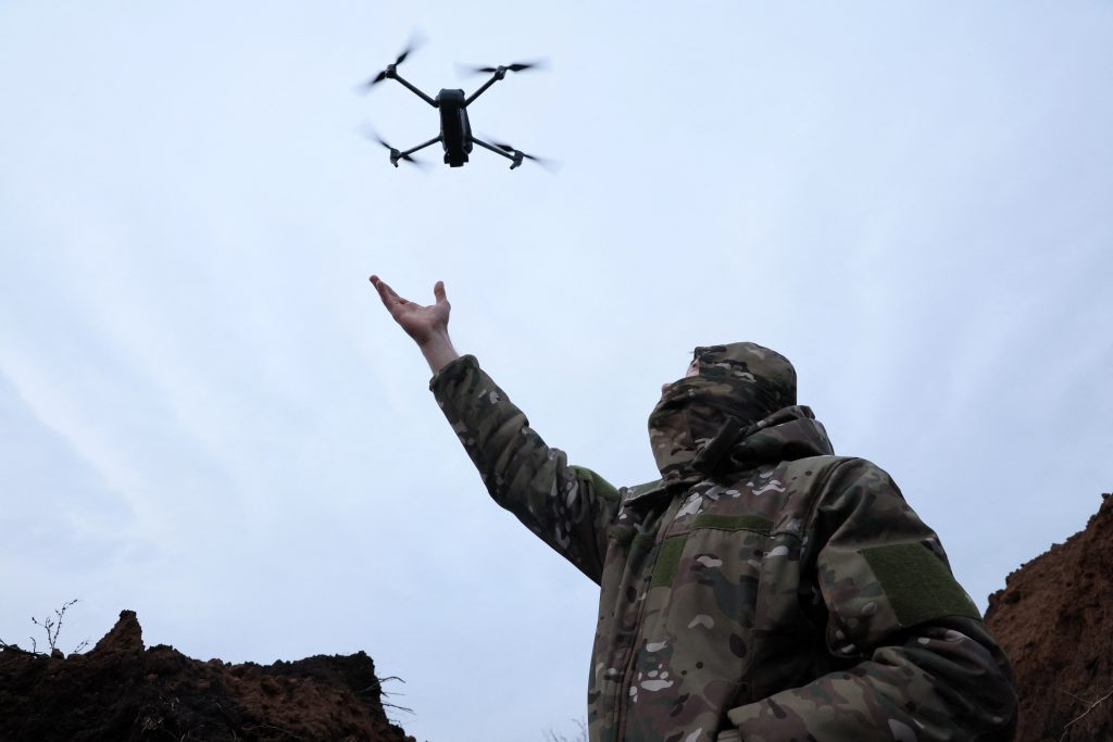 Photo: "Soap", 30, a soldier with the 58th Independent Motorized Infantry Brigade of the Ukrainian Army catches a drone while testing it, as Russia's invasion of Ukraine continues, near Bakhmut, Ukraine, November 25, 2022. Credit: REUTERS/Leah Millis