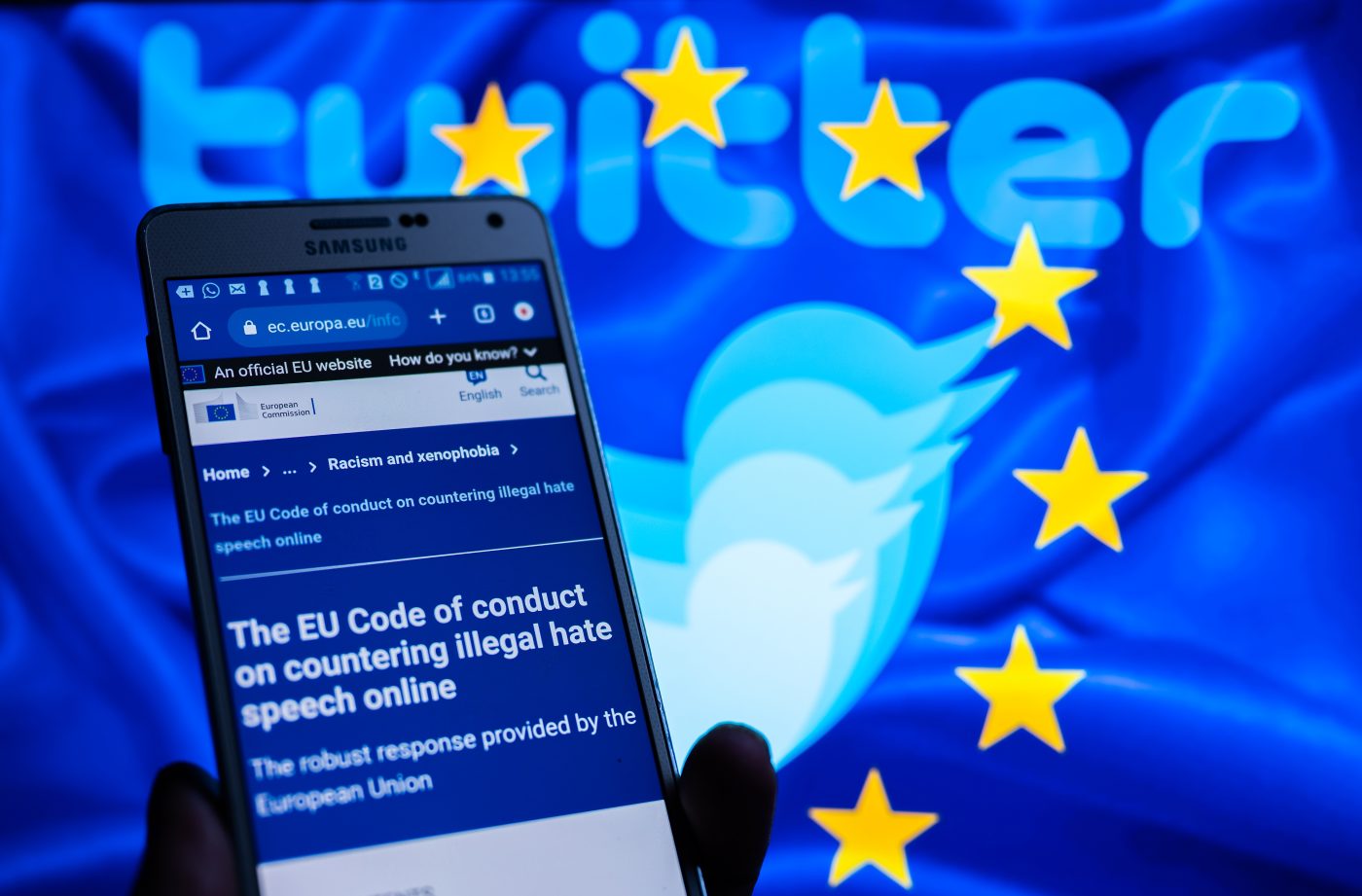 Photo: Twitter logo displayed on screen with EU code of conduct on countering illegal hate speech online, are seen in this illustration, in Brussels, Belgium, on November 27, 2022 Credit: Jonathan Raa/NurPhoto