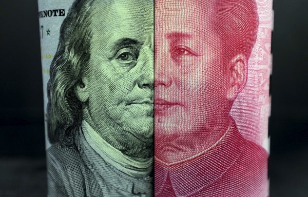 Photo: A US 100-dollar banknote with a portrait of Benjamin Franklin and a Chinese 100-yuan banknote with a portrait of late Chinese Chairman Mao Zedong are seen in the picture illustration in Beijing, China, January 21, 2016. Credit: REUTERS/Jason Lee