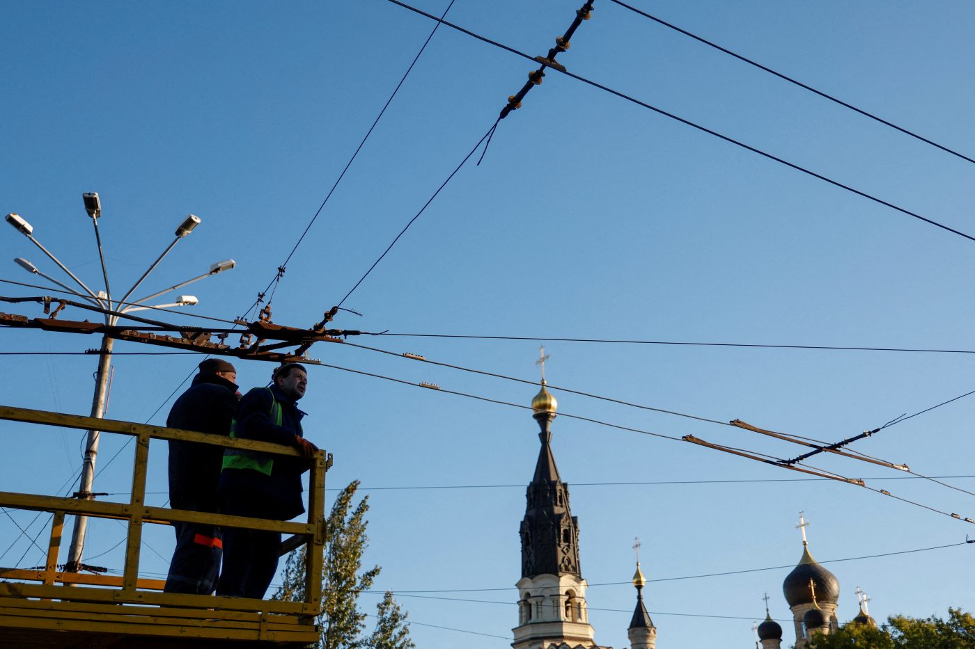 Photo: Municipal workers check an electricity network of public transport before possible energy outages, amid Russia's attack on Ukraine, in Mykolaiv, Ukraine October 20, 2022. Credit: REUTERS/Valentyn Ogirenko