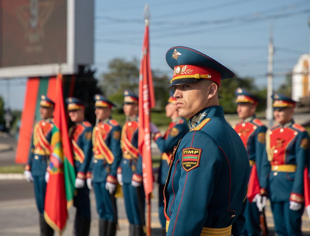 Photo: Service members take part in a flag-rising ceremony on Victory Day, marking the 77th anniversary of the victory over Nazi Germany in World War Two, in Tiraspol, in Moldova's breakaway region of Transnistria, May 9, 2022. Credit: REUTERS/Vladislav Bachev