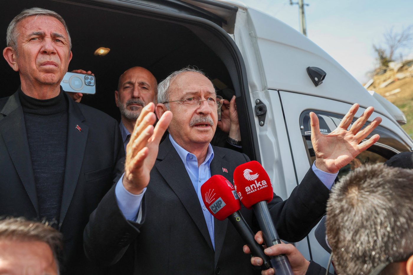 Photo: Kemal Kilicdaroglu, leader of Republican People's Party (CHP) and presidential candidate of the six-party main opposition alliance, accompanied by Ankara Mayor Mansur Yasa, talks to media as he visits earthquake-hit Kahramanmaras province, Turkey March 11, 2023. Credit: Alp Eren Kaya/Republican People's Party/Handout via REUTERS