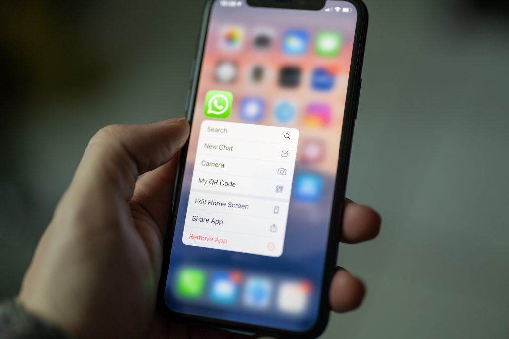 Photo: iPhone with the home screen showing the Whatsapp application settings options open. Credit: Dimitri Karastelev/Unsplash